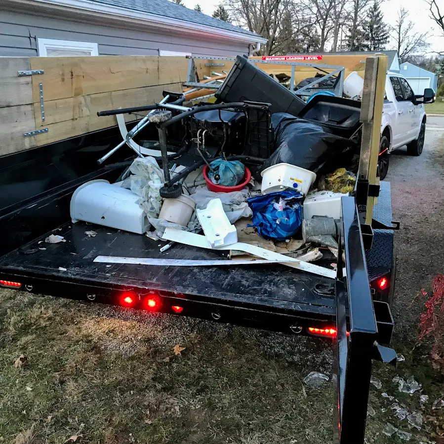 Roll-off dumpster delivered to a residential driveway in Libby